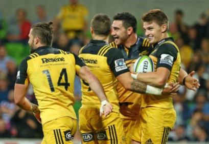 Beauden Barrett is congratulated by his teammates after his second try against Melbourne Rebels