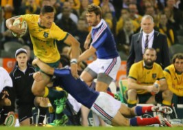 The Wallabies fullback Israel Folau is looking for the offload with Ewen McKenzie watching on