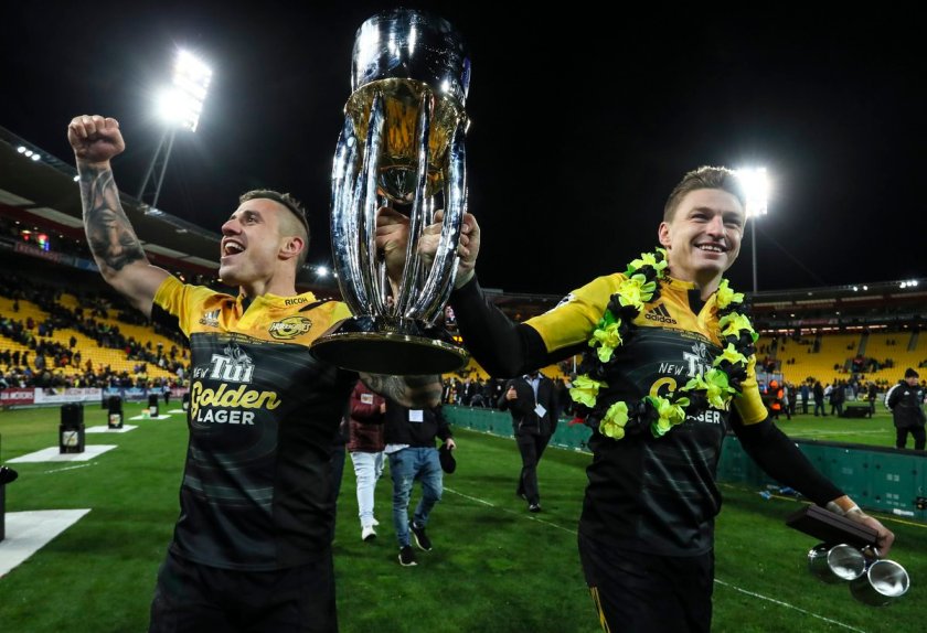 The Hurricanes players TJ Perenara and Beauden Barrett holds the 2016 Super Rugby Trophy at Westpac Stadium, Wellington