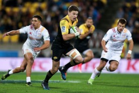 Beauden Barrett is running the ball for the Hurricanes against the Chiefs at Westpac Stadium, Wellington, during the Super Rugby 2017