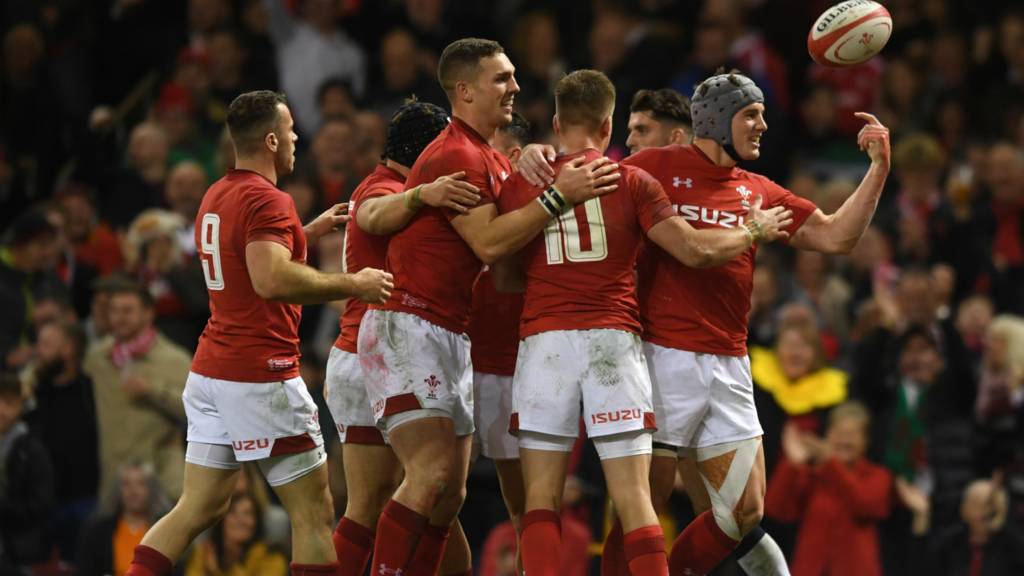 The Wales centre Jonathan Davies is celebrating after scoring a try against Scotland during the 2018 Autumn Tour in Principality Stadium